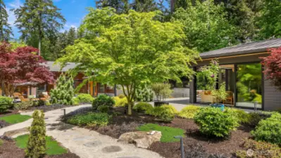 The grounds are beautifully landscaped with stone set pathways.
