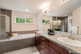 Plenty of storage and counter space in the primary bathroom with dual vanities