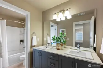 Large hall bath with double vanity.