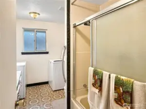 Full size bathroom with laundry.