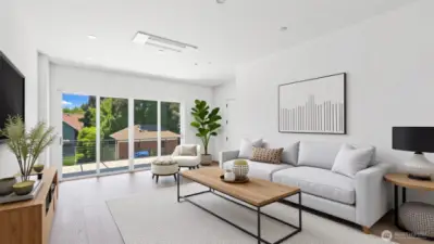 Living Room With Large Window & Ample Natural Light + Ductless Minisplit