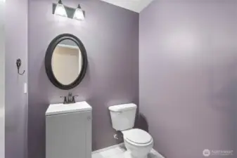 Half bath with vanity storage.