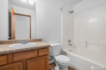 One of two guest bathrooms located on the upper level, each with a shower/tub combo.