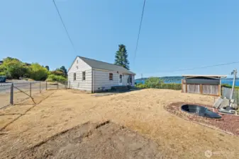 Enjoy a prime corner location with clear sightlines to the lake, surrounded by mature landscaping that offers both charm and privacy.