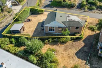 Highlighted aerial view showcasing the generous corner lot and existing home footprint—offering ample space and potential for future expansion, outdoor living, or redevelopment.