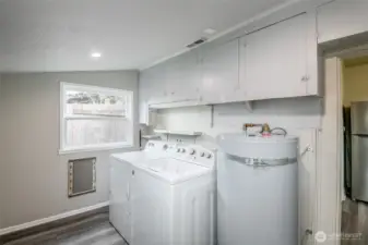 Conveniently located laundry room and mud room just off the kitchen