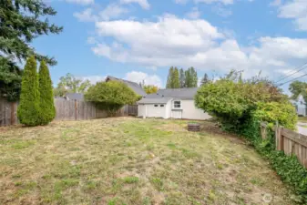 This yard is a blank canvas - add a fire pit, trampoline, gazebo or garden boxes - lots of room to make it your own!