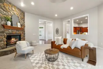 Step inside and be amazed by this fantastic living area! This expansive space boasts incredibly high ceilings, soaring over 10 feet, creating an open and airy feel. The focal point is undoubtedly the inviting and cozy gas fireplace, perfect for creating a warm and inviting atmosphere, making this room ideal for relaxation and entertaining.