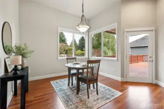Just off the kitchen is a lovely casual eating area, which leads to the expansive deck.