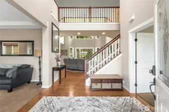 The grand front entry welcomes you in with vaulted ceilings and an inviting presence. A perfect introduction to the elegance found throughout the home.
