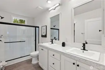 Master Bath with Double Vanity and Walk in Shower and Closet.