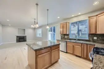 Kitchen with island, stainless steel appliances, gas cooktop, and rollout drawers