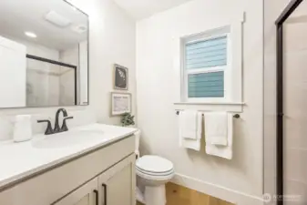 Beautiful main floor 3/4 bath with bedroom on the main floor. Photos are of the Magnolia model home at Maywood Heights on lot 8. Photos are for illustration purposes only; colors and finishes will vary.