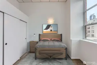 Enjoy all this natural light. Bedroom easily fits a king bed with 1 night stand or a queen with 2.