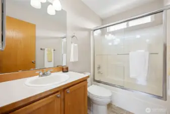 Hall bath upstairs with updated shower doors.