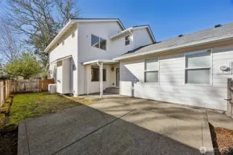 Large paved patio and covered area for outdoor entertaining.