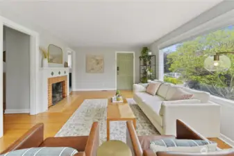 Recently refinished hardwood floors, fresh paint, and an abundance of natural light.