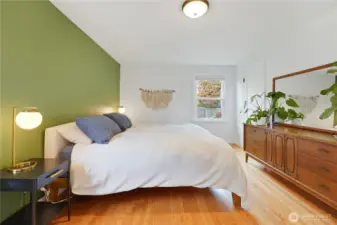 Large primary bedroom with windows facing South and West gives the room tons of natural light.
