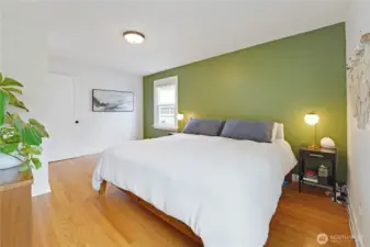 Large primary bedroom with windows facing South and West gives the room tons of natural light.