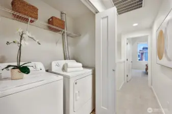 Laundry upstairs hallway near bedrooms for convenience