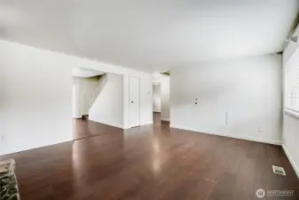 Spacious and bright living room with durable LVP flooring and a stunning wood-burning fireplace. The open-concept design creates a warm, inviting heart of this beautifully updated 4-bedroom home in Redmond’s top-rated Union Hill neighborhood