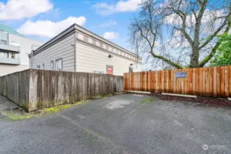 Parking spot with fence on left and in front