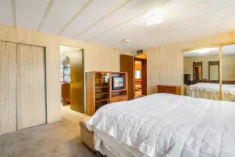 From the primary bedroom, notice the door in the middle is to the primary bathroom, and the door to the right of it goes into the hallway.