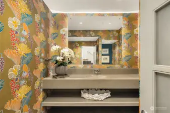 Main floor powder bathroom.  We love the wallpaper and architectural desgined vanity.