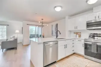 Kitchen open to dining room and look out to the lake view
