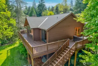 The kitchen eating nook has french doors that open the to huge wrap around deck.