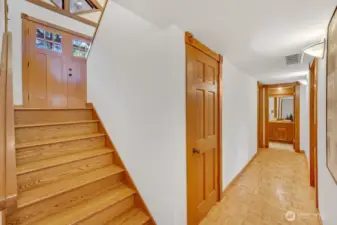 The lower floor also has hardwood floors. This floor has two bedrooms, a large bonus room with wood-burning fireplace, a full bath, and laundry room.