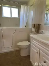 Bath has walk in tub