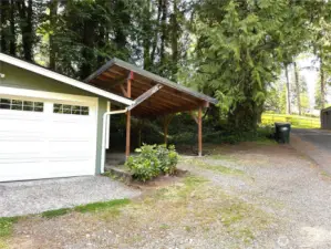 Carport and additional uncovered spot next to the carport.