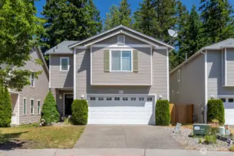 Charming curb appeal welcomes you to this Silver Creek home, set on a quiet lane with a covered front porch and tidy landscaping. A perfect first impression that sets the tone for what’s inside.