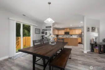 A designated dining area sits just off the kitchen, ideal for everyday meals or hosting holiday gatherings. Patio door windows bring in even more light.