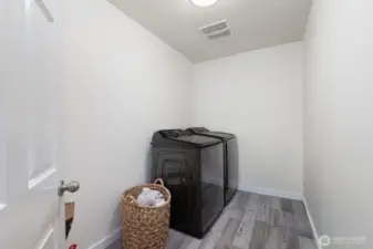 Convenient upstairs laundry room with washer/dryer hookups  makes laundry day a breeze.