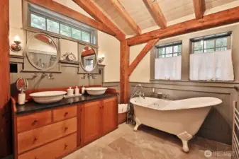 All bathroom cabinets are custom Shaker drysink reproductions with Soapstone surfaces. Floor is porcelain tiles.