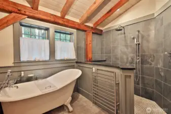 Shower has Italian Slate walls and a marble floor. Heated towel rack too! Enjoy a relaxing bath in the clawfoot tub.