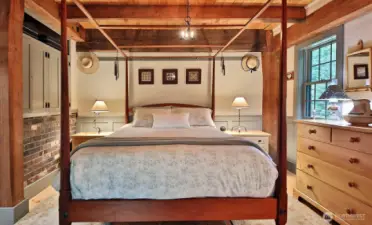 Primary Bedroom with custom cabinets (to the left of the bed). You are in the Southeast corner of the home.