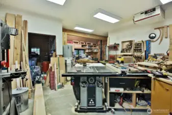 Spacious workshop with a wood stove and more space than reflected in this photo.