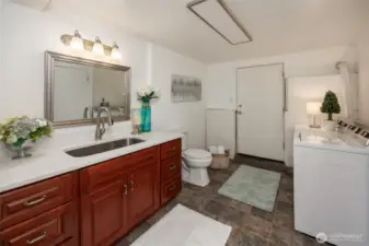 Lower level bathroom and laundry room.