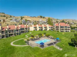 Condo overlooks the hillside swimming pool.