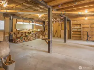 HUGE detached garage/shop with built-in shelving and workbenches.