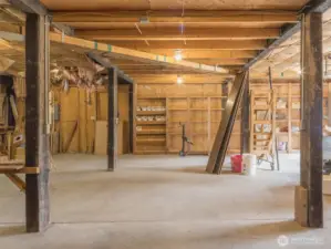 Spacious and well-equipped, this oversized shop/garage offers the ultimate setup for projects, storage, and tinkering.