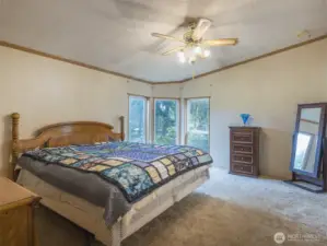 The primary bedroom offers a peaceful retreat with a bay window - perfect for reading nook, relaxing, or adding a cozy seating area.