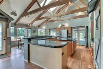 Kitchen view three from the Great Room, love the generous counter space - just bring your favorite stools. Walk-in pantry is to your right, door to patio and dining to your left, White Room straight ahead through French Doors. We LOVE ALL the WINDOWS! So large and lets in all the light.