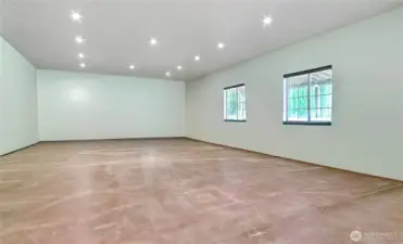 Shop Bay Three view, we used it for a home office, workout area and storage. Has it's own cadet heater. Fully finished, well lit and 3 windows and side door.