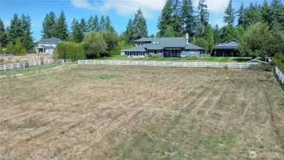 Drone view of he back of the property, we used it for mini bikes and go carts. You can have steer, horses, goats, or? Chicken Coop to your right along the fence line.