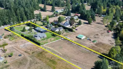 Drone overhead view of the property. Spurgeon Creek trickles along the back.