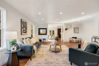 Cozy double-sided fireplace connects the living and dining spaces with warmth and charm.